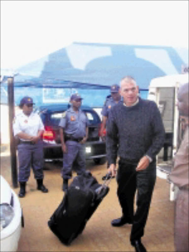 EARLY PAROLE: The police were out in full force when Mark Scott-Crossley was released from the Bushbuckridge correctional services centre yesterday. Pic. Riot Hlatshwayo. © Sowetan.