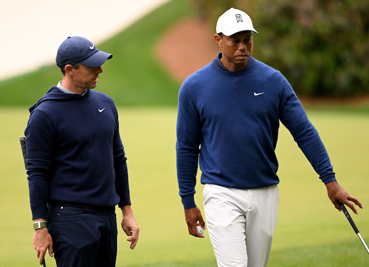 Rory McIlroy of Northern Ireland, left, and Tiger Woods of the US. Picture: ROSS KINNAID/GETTY IMAGES