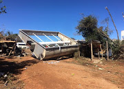 Two people sustained minor injuries in Zandspruit after trees and advertising boards fell onto their houses.