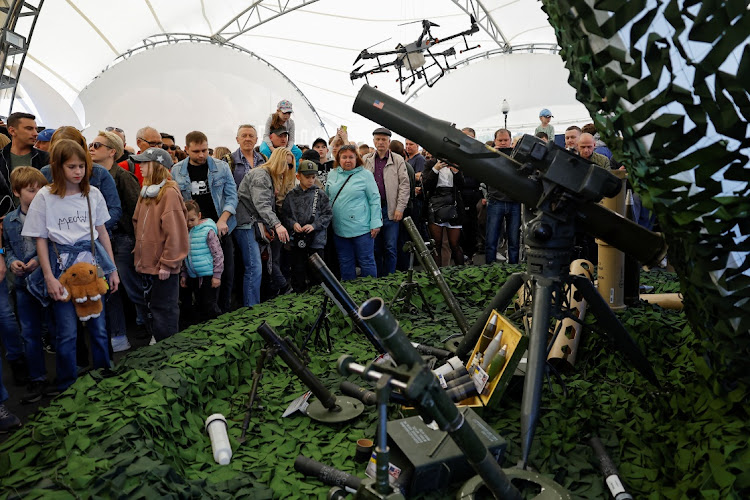 People visit an exhibition which displays armoured vehicles and equipment captured by the Russian army from Ukrainian forces in the course of Russia-Ukraine conflict, at Victory Park open-air museum on Poklonnaya Gora in Moscow, Russia, on May 1 2024.
