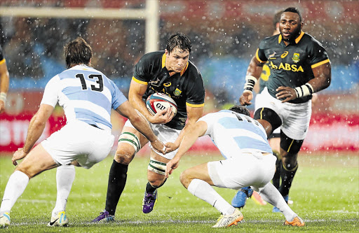 Springbok flank Francois Louw prepares to burst through a tackle during the Rugby Championship match between South Africa and Argentina at Loftus Versfeld in Pretoria. Louw will be crucial in the contest for possession on the ground.