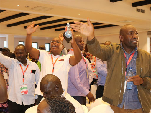 MCAs react to Homa Bay senator Moses Kajwang's speech at the Third Legislative Summit at Pride Inn Paradise Beach Hotel in Mombasa on Wednesday, May 23, 2018. /JOHN CHESOLI