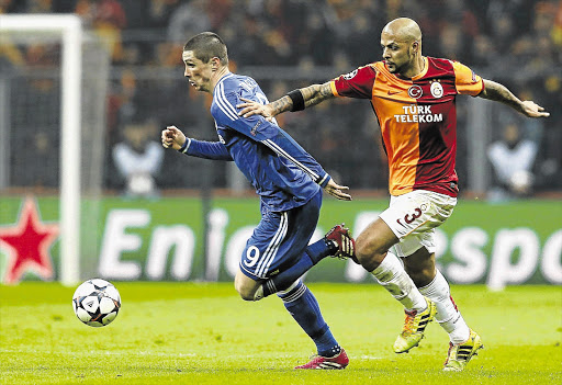THE RACE IS ON: Chelsea's Fernando Torres, left, is challenged by Galatasaray's Felipe Melo during their Champions League showdown at Turk Telekom Arena in Istanbul last night.