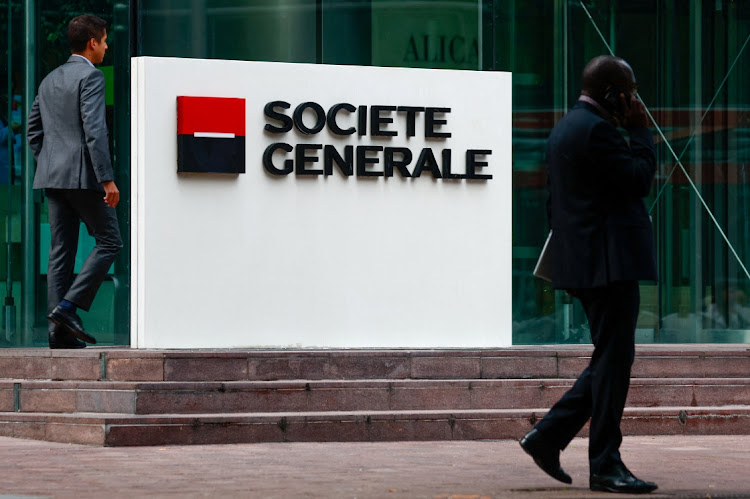 People walk past a logo of French bank Societe Generale near Paris, France. September 14 2023. Picture: GONZALO FUENTES/REUTERS