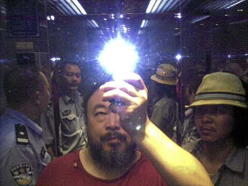 Dissident Chinese artist Ai Weiwei takes a selfie during his arrest.