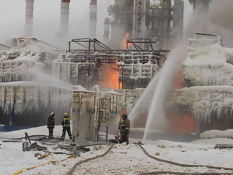 Firefighters work to extinguish a fire at a terminal belonging to Novatek, Russia's largest liquefied natural gas producer, in Russia, January 21 2024. Picture: HEAD OF KINGISEPPSKY DISTRICT ADMINISTRATION/REUTERS