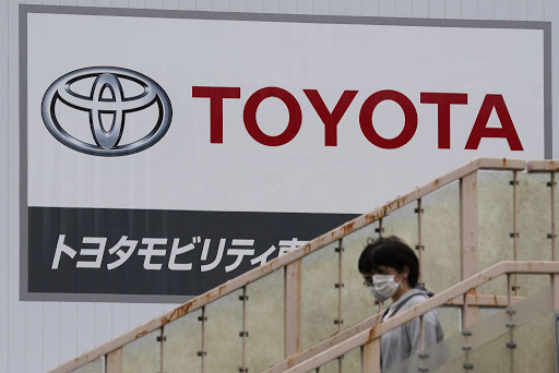 Toyota cut its annual production target on Friday by 300,000 vehicles because of a global shortage of chips and supplies of auto parts.