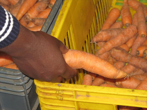 Carrots on sale. /FILE
