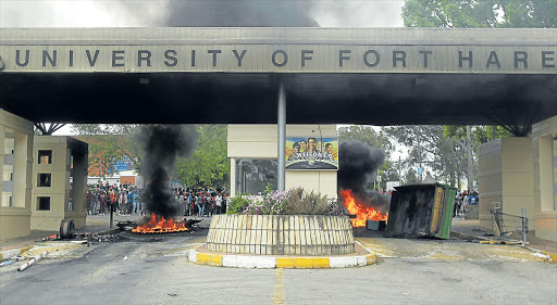 WARM WELCOME: UFH students in Alice block the main entrance with burning barricades Picture: SIBONGILE NGALWA