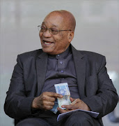 President Jacob Zuma offers a man who came to the edge of the stage money from his pocket as thousands of people gather at Orlando Stadium, Orlando East, Soweto to celebrate Youth Day. The day commemorates those killed on June 16, 1976 in the Soweto Uprising, where some 20,000 school pupils protested peacefully against Afrikaans being the medium of instruction in education. Police opened fire on the protesters killing hundreds. Picture:  CORNELL   TUKIRI  Â© THE TIMES 16 June 2016