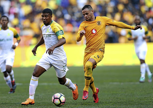 Lyle Lakay (L) of Mamelodi Sundowns pulls away from Kaizer Chiefs striker Gustavo Paez during the Absa Premiership on August 4 2018.