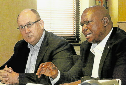 TENSE SITUATION: DA mayor Athol Trollip, left, and his deputy the UDM's Mongameli Bobani. The parties are coalition members in the Nelson Mandela Bay metro. Picture: EUGENE COETZEE