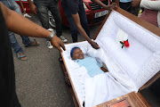 Members of the National Funeral Practitioners Association of SA, who gathered outside Durban's Gale Street mortuary on Monday, held a mock funeral for the 'white monopoly' they say is still in control of the funeral industry.