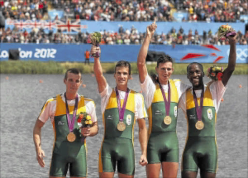 WHAT A FIGHTBACK: SA's gold medalists Sizwe Ndlovu, John Smith, Matthew Brittain and James Thompson celebrate at the victory ceremony. Photo: REUTERS