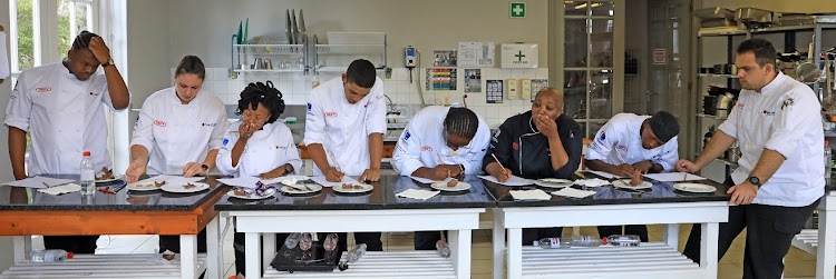 The Capsicum Culinary Studio Rosebank Joburg hot cross bun and Easter egg tasting team. from left to right: Michael Okeke, Lara Else, Boipelo Losaba, Enzo Botha, Ayanda Ngcobo, chef/lecturer Andile Magwaza, Motsamai Mosia and Renier Claassens.