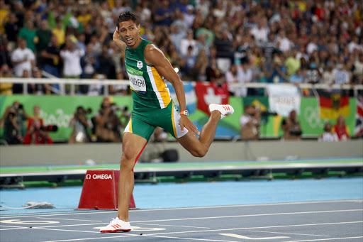 Wayde van Niekerk of South Africa reacts after winning the Men's 400 meter final on Day 9 of the Rio 2016 Olympic Games at the Olympic Stadium on August 14, 2016 in Rio de Janeiro, Brazil. (Photo by Cameron Spencer/Getty Images)