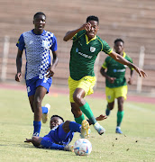 Khomotjo Lekoloane of Baroka FC and Mcedi Vandala of Magesi FC during the Motsepe Foundation Championship match.