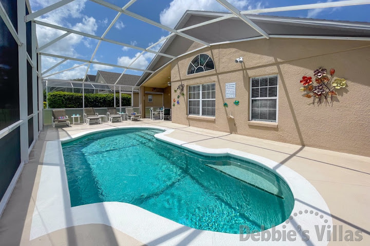 Make a splash in the sun-drenched pool after a day at the parks at this Kissimmee vacation villa
