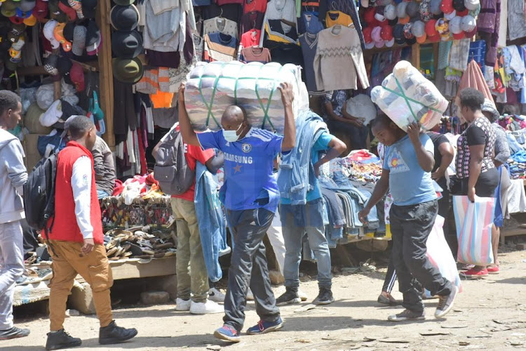 Business people in Gikomba market carry on their daily activities prior to the budget reading 2022/23 on April 7, 2022.