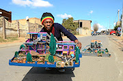 Mveliso Ntaba is an artist that recycles cardboard and plastic to make architectural  structures.