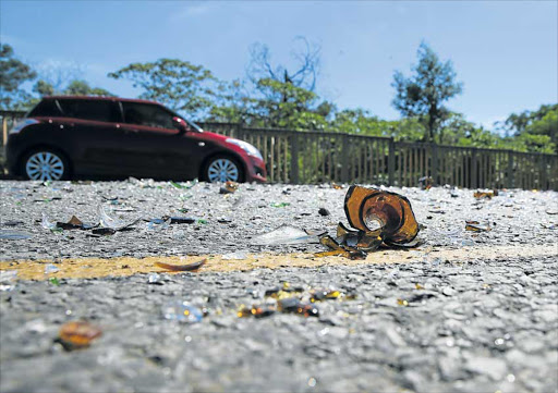 IN THE DARK: Glass lies on the road where residents from Potsdam blocked it with rocks, tree branches and shards of glass in protest over the lack of services, such as electricity, in their area Picture: ALAN EASON