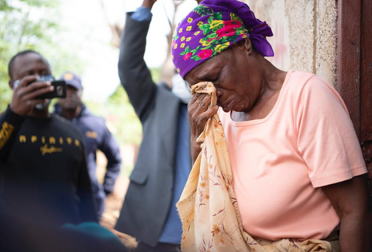 Emotion overcomes an elderly woman after she received a food parcel from the Nelson Mandela Foundation and others on Freedom Day.