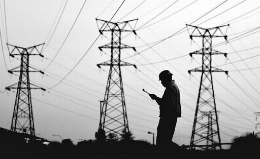 An Eskom worker checks power lines. Picture: MARIANNE SCHWANKHART