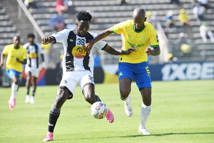 Mamelodi Sundowns' Mosa Lebusa challenges File Traore of TP Mazembe in their 2023-24 Caf Champions League group stage match at Lucas Moripe Stadium on March 2.