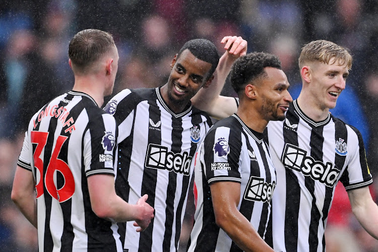 Alexander Isak of Newcastle United celebrates scoring his team's fourth goal with teammates Sean Longstaff, Jacob Murphy and Anthony Gordon during the Premier League match between Burnley FC and Newcastle United at Turf Moor on May 4 2024 in Burnley, England. Picture: STU FORSTER/GETTY IMAGES