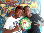 Emerging boxing trainer Junior Assoya and his  ABU welterweight champion Eric Kapia Mukadi. / Supplied