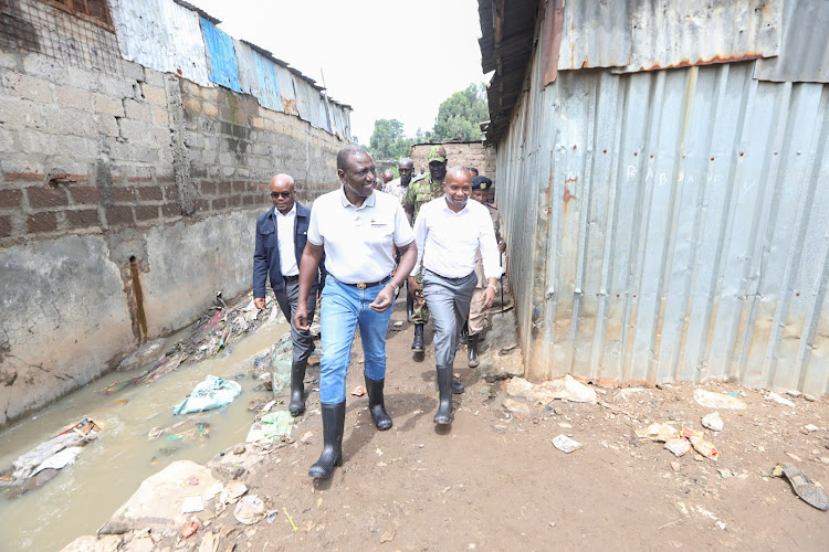 President William Ruto accompanied by Interior CS Kithure Kindiki and Interior PS Raymond Omollo when he visited Kiamaiko to assess the flood situation on April 6, 2024.