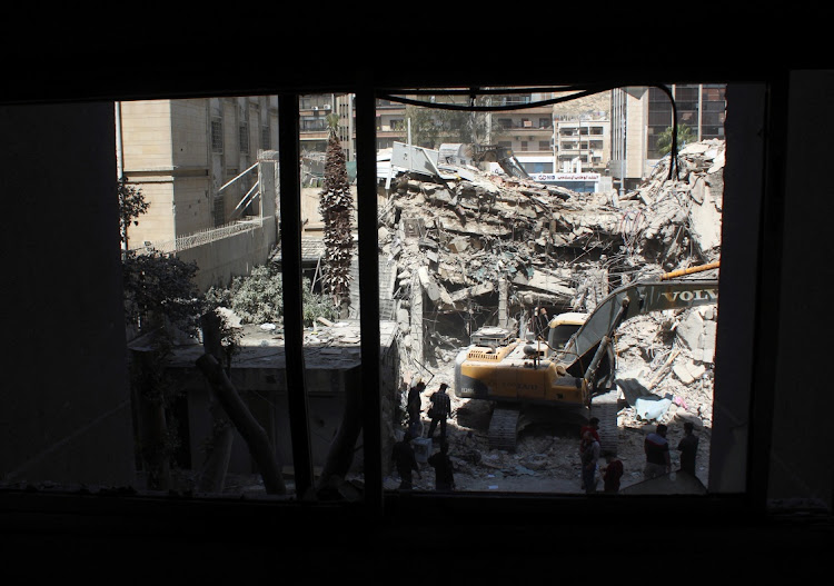 An excavator clears rubble after a suspected Israeli strike on Monday on Iran's consulate, adjacent to the main Iranian embassy building, which Iran said had killed seven military personnel including two key figures in the Quds Force, in the Syrian capital Damascus, Syria April 2, 2024.