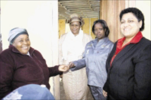 ELATED: Jabu Nxumalo, left, MaKhumalo Zuma, Sbongile Nxumalo and KZN MEC for human settlements Maggie Govender during the official handing over of a house. Pic: THULI DLAMINI. 19/07/2009. © Sowetan.