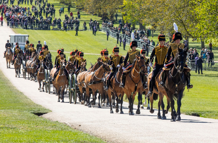 The King's Troop Royal Horse Artillery arrives at Windsor Castle in preparation for the Gun Salute on the palace grounds on the day of the funeral of Britain's Prince Philip, husband of Queen Elizabeth, on April 17 2021.