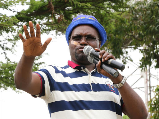 Emurua Dikirr MP Johanna Ngeno addresses the protesters at Singoiroi in Chepalungu on Saturday. He called on actions to be taken on the perpetrators of the incident that led to injury of governor Isaac Rutto.Photo/Felix Kipkemoi