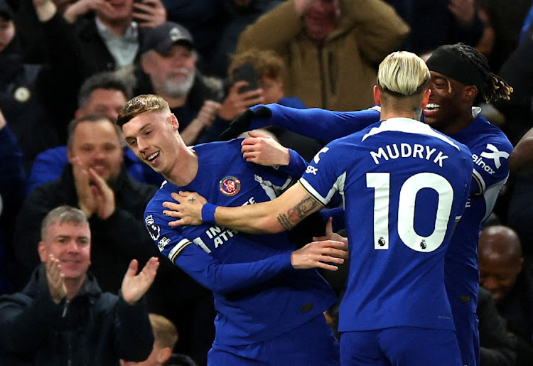 Chelsea's Cole Palmer celebrates one of his four goals with Mykhailo Mudryk and Noni Madueke in the Premier League match against Everton at Stamford Bridge, London on April 15, 2024. Picture: TOBY MELVILLE/REUTERS
