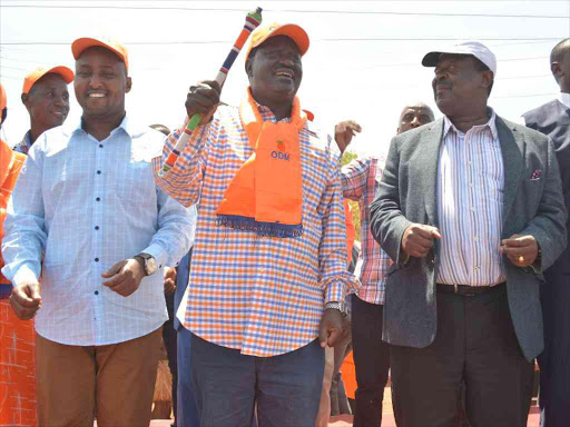 Suna East MP Junet Mohamed, ODM leader Raila Odinga and ANC leader Musalia Mudavadi address a public rally at Kathwana town in Tharaka Nithi county on Wednesday. They promised to work together on December 7 /EMMANUEL WANSON