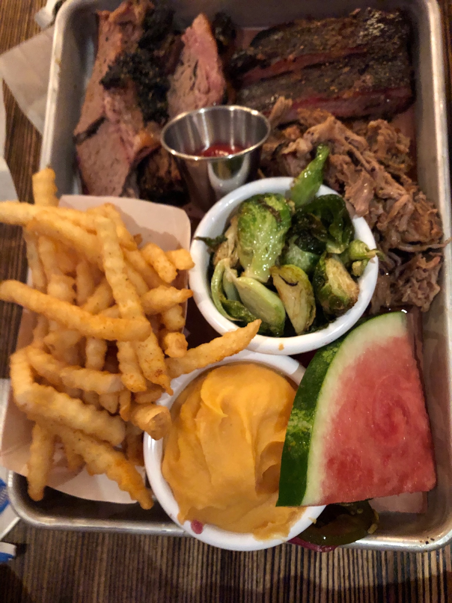 French fries, sweet potato mash, Brussel sprouts, brisket, ribs, pulled pork. And no I didn’t eat that all myself I split it haha!