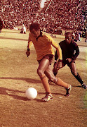 Kaizer Motaung dribbling past Oscar Dlamini of Orlando Pirates  in the early 70s.