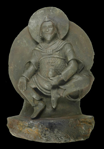 An undated handout picture released on September 26, 2012 shows a thousand year-old ancient Buddhist statue known as the Iron Man which is believed to represent a stylistic hybrid between the Buddhist and pre-Buddhist Bon culture that portrays the god Vaisravana. The statue was discovered in 1938 by an expedition of German scientists led by renowned zoologist Ernst Schäfer and supported by Nazi SS Chief Heinrich Himmler. A team from Stuttgart University have analysed the statue and were able to classify it as an ataxite, a rare class of iron meteorite.