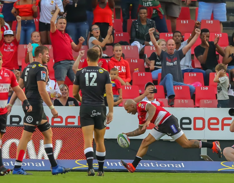Jubilant supporters as Lionel Mapoe of the Emirates Lions scores a try during the Super Rugby match against the Cell C Sharks at Emirates Airline Park on February 17, 2018 in Johannesburg, South Africa.