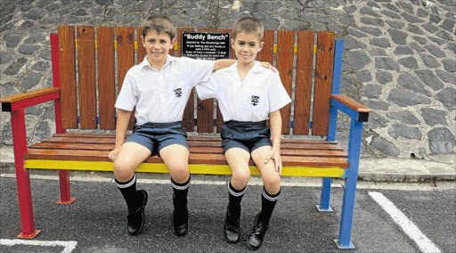 CAMARADERIE: Best friends Daniel Woodin and Troy Woodbridge of Selborne Primary sit on the ‘Buddy Bench’ which aims to foster friendships at their school Picture: QAQAMBA MAGADLA