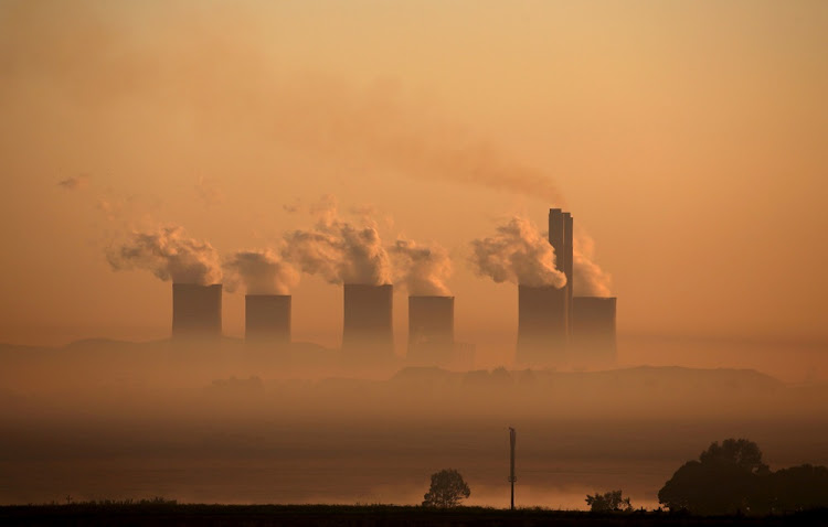 Steam rises at sunrise from the Lethabo Power Station, a coal-fired power station owned by state power utility ESKOM near Sasolburg, South Africa, March 2, 2016.
