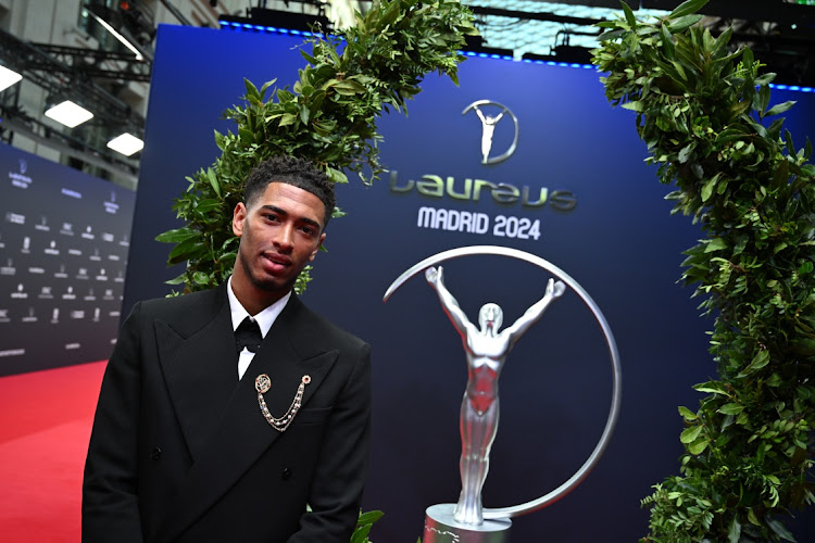 Jude Bellingham poses with the Laureus trophy and wreath on the red carpet during the Laureus World Sports Awards at Galería De Cristal in Madrid, Spain on Monday.