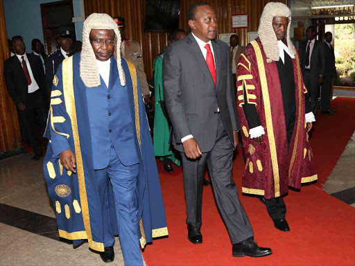 President Uhuru Kenyatta is welcomed by National assembly speaker Justin Muturi and his senate counterpart Ekwe Ethuro in Parliament where he gave the State of Nation address on March 31, 2016 .Photo/HEZRON NJOROGE
