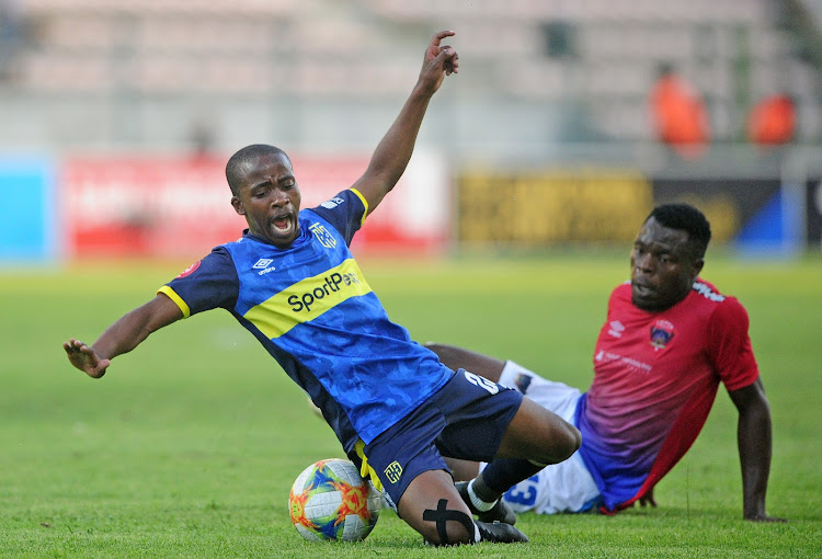 Thabo Nodada of Cape Town City is fouled by Meshack Maphangule of Chippa United during the Absa Premiership 2019/20 game between Cape Town City and Chippa United at Athlone Stadium in Cape Town on 7 December 2019.