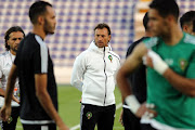Morocco's French head coach Herve Renard (C) watches as players perform drills during a training session at the Sheikh Tahnoun Bin Mohammed Stadium in Al Ain on January 5, 2017, part of their preparations ahead of the African Cup of Nations.