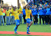 Percy Tau accompanied Tiyani Mabunda of Mamelodi Sundowns to receive his medals with dance during the Absa Premiership 2017/18 football match between Bloemfontein Celtic and Mamelodi Sundowns at Dr Petrus Molemela Stadium, Bloemfontein on 12 May 2018.
