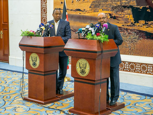 President Uhuru Kenyatta and his Sudan counterpart Omar al Bashir address a press conference after the signing of bilateral agreements at the Presidents Palace in Khartoum, Sudan./PSCU