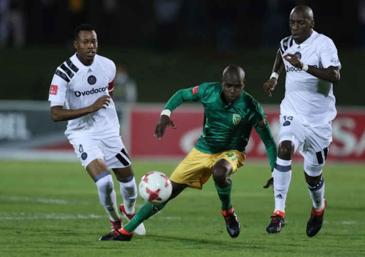 Lerato Lamola of Golden Arrows and Musa Nyatama of Orlando Pirates during the Absa Premiership match between Golden Arrows and Orlando Pirates at Princess Magogo Stadium on March 17, 2018 in Durban.